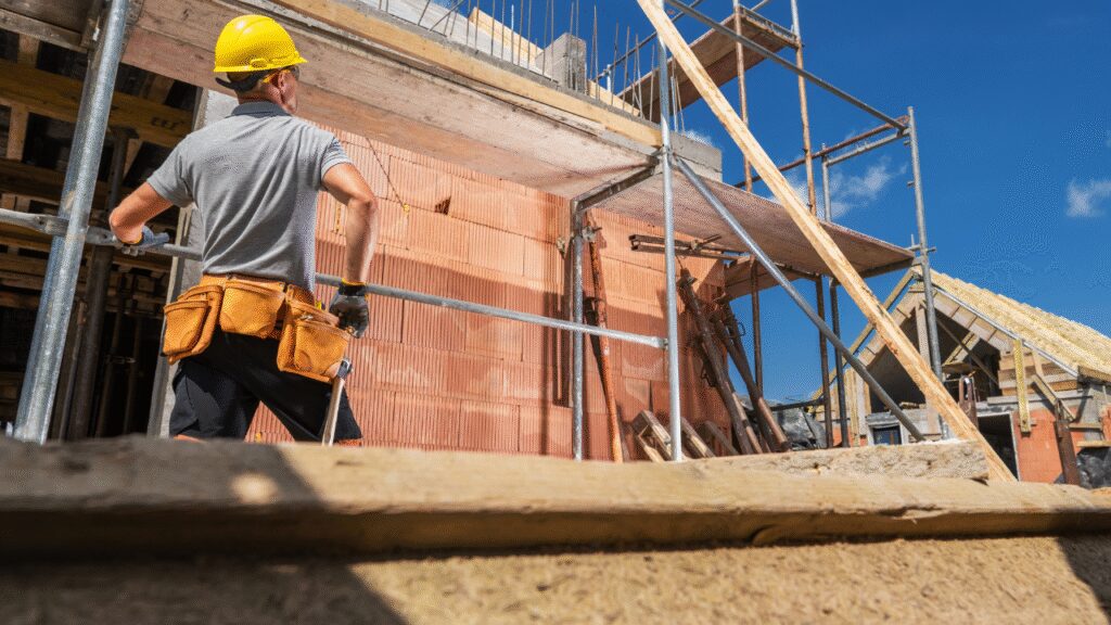 A vibrant cityscape of Calgary with construction sites and workers in action, showcasing various types of contractors at work