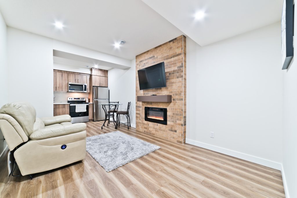 A modern new home construction site in Calgary with workers and equipment